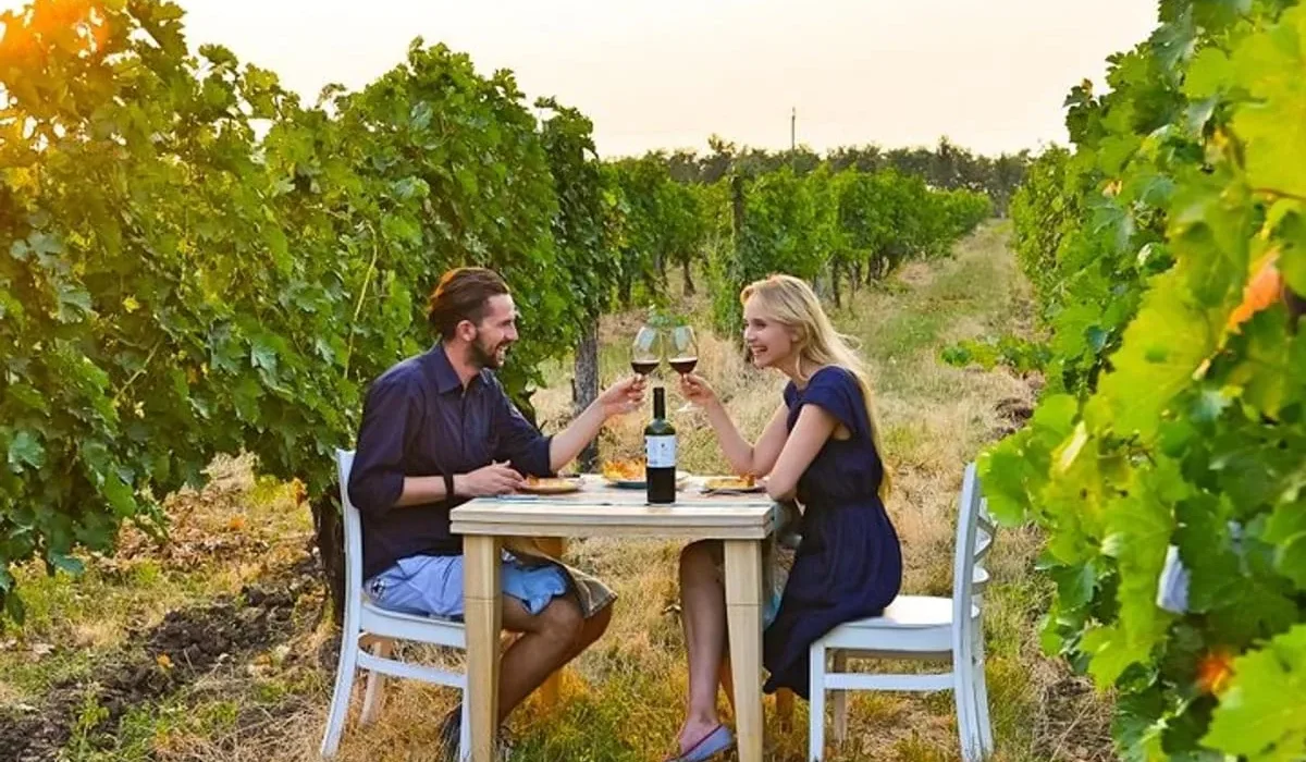 A small family winery in Moldova pouring locally made wine for guests during a vineyard tasting.