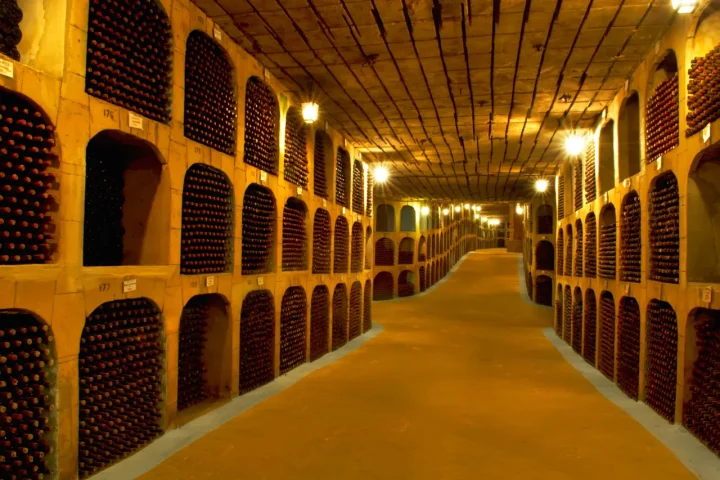 Bottles of wine resting in the underground galleries of Cricova winery, Moldova's famous underground wine city.