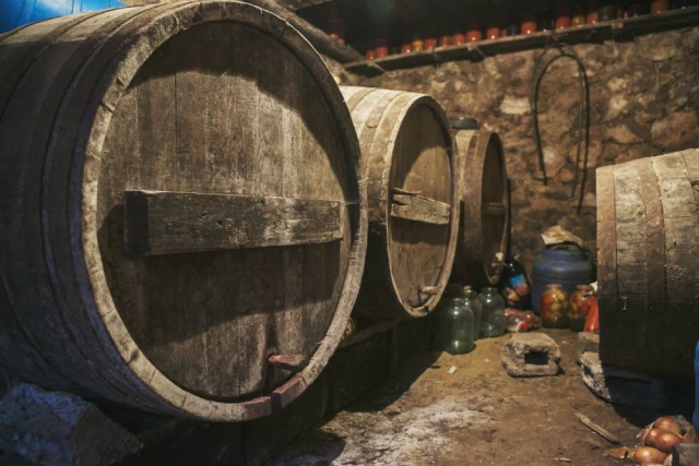 Homemade Wine: Moldova's Village Tradition 12 Barrels of homemade wine resting in a traditional Moldovan village home cellar, part of a centuries-old tradition.